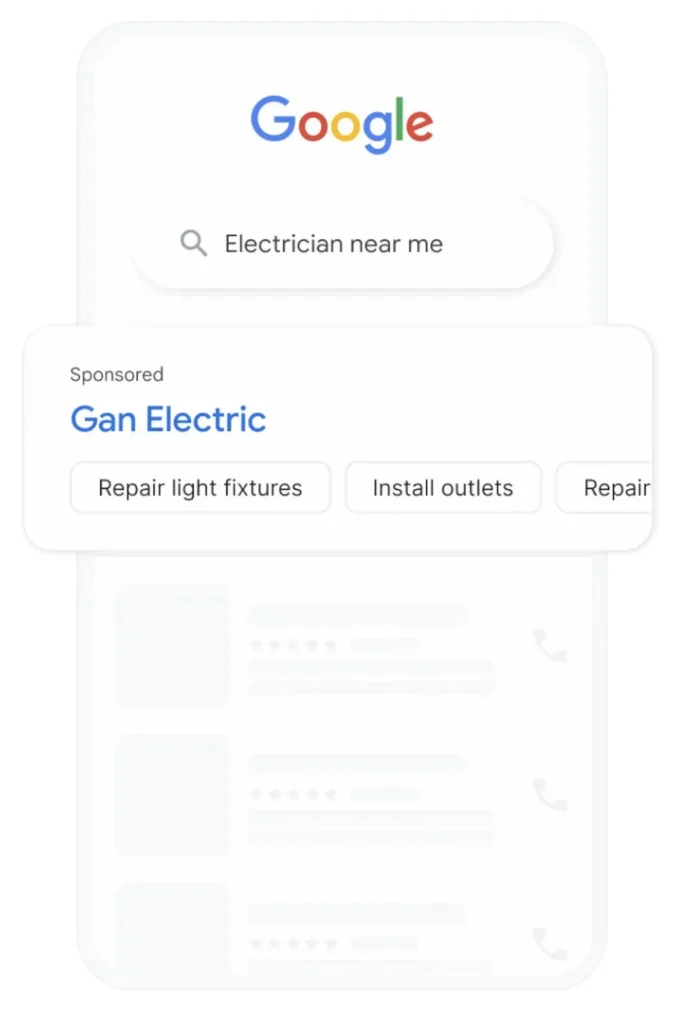 A phone showing a Google search for electrician near me, with a sponsored result for a local electrician listing its services.