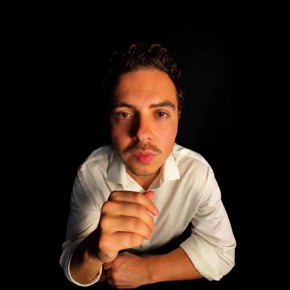 Jonathan Duran, founder of The AI Management, photographed on black